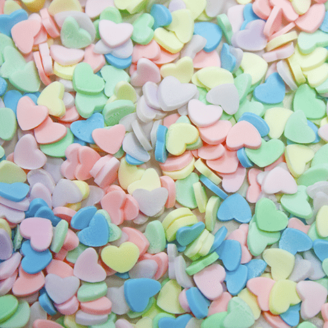 A mix of pastel coloured heart shaped sprinkles