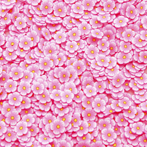 A mix of pink flower shaped sprinkles
