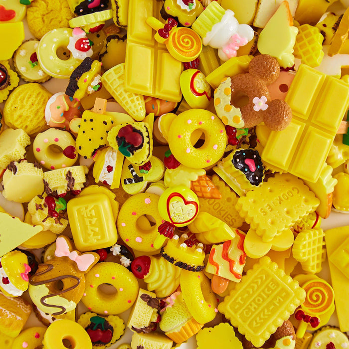 A mix of multi-shaped yellow charms