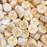 A mix of pale yellow banana slices charms