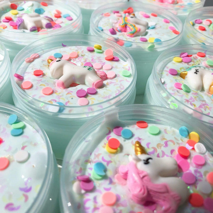 Several dreamy unicorn slimes in their containers
