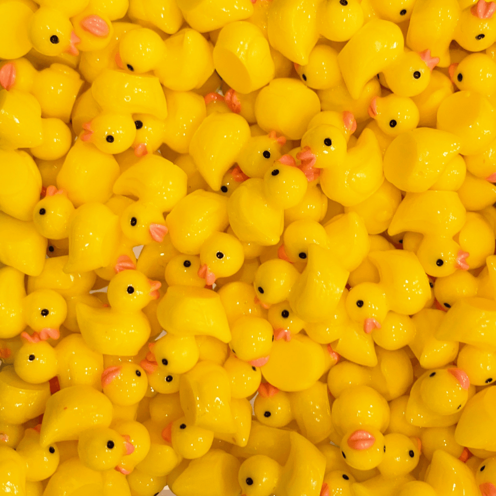 A mix of yellow duck charms