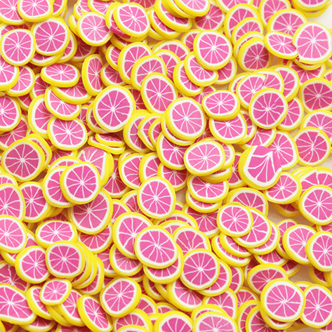A mix of pink and yellow grapefruit sprinkles