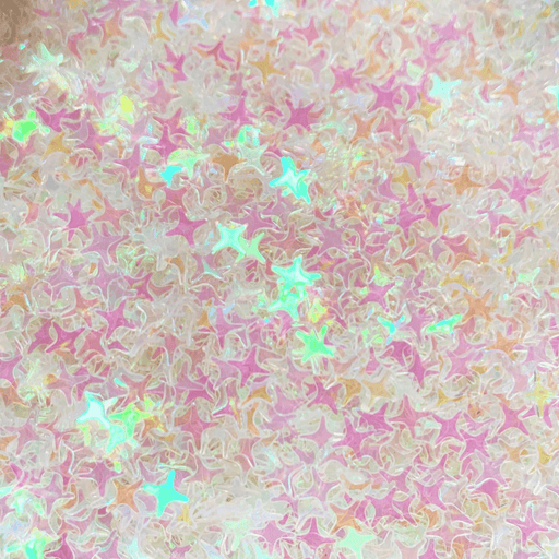 A mix of iridescent pink star sprinkles