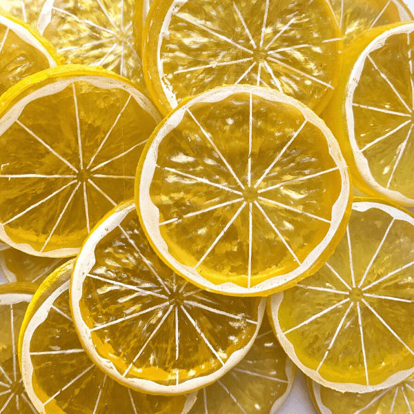 A mix of yellow lemon slice charms 