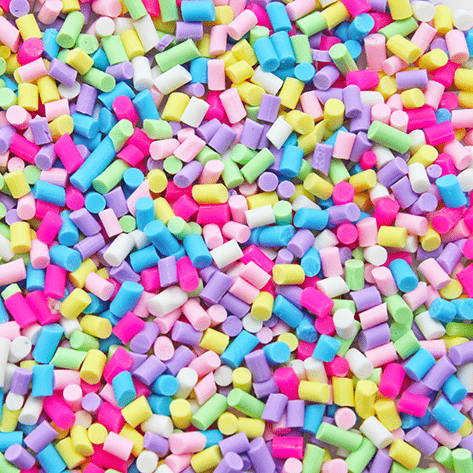 A mix of bright coloured mini sprinkles