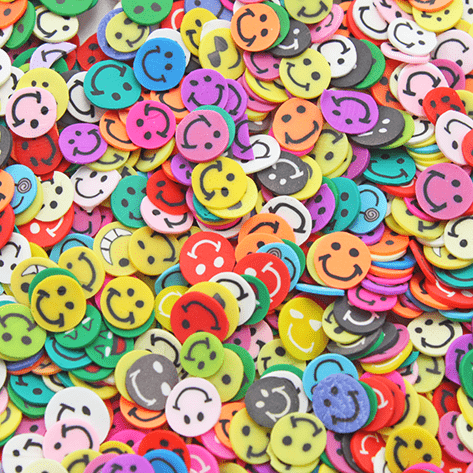 A mix of multicoloured smiley face sprinkles
