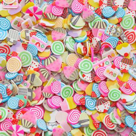 A mix of multicoloured sprinkles with several bakery related shapes