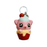 A squishy keychain with the shape of a pink cat, inside a red container with peach drips and light blue icing on its head with a red top