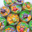 Several multicoloured cloud slimes in green, orange and purple. Each comes with a monster charm as a decoration.