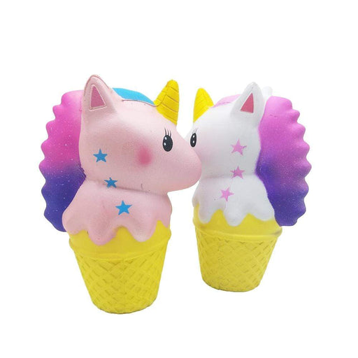 Two yellow ice cream cone squishies, one with is a pink unicorn and the other one is a white unicorn, both with a yellow horn and gradient pink to purple hair.