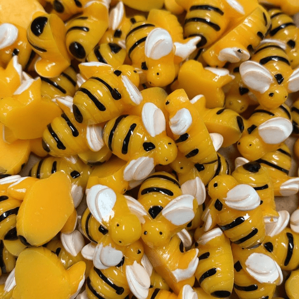 A mix of yellow bee charms