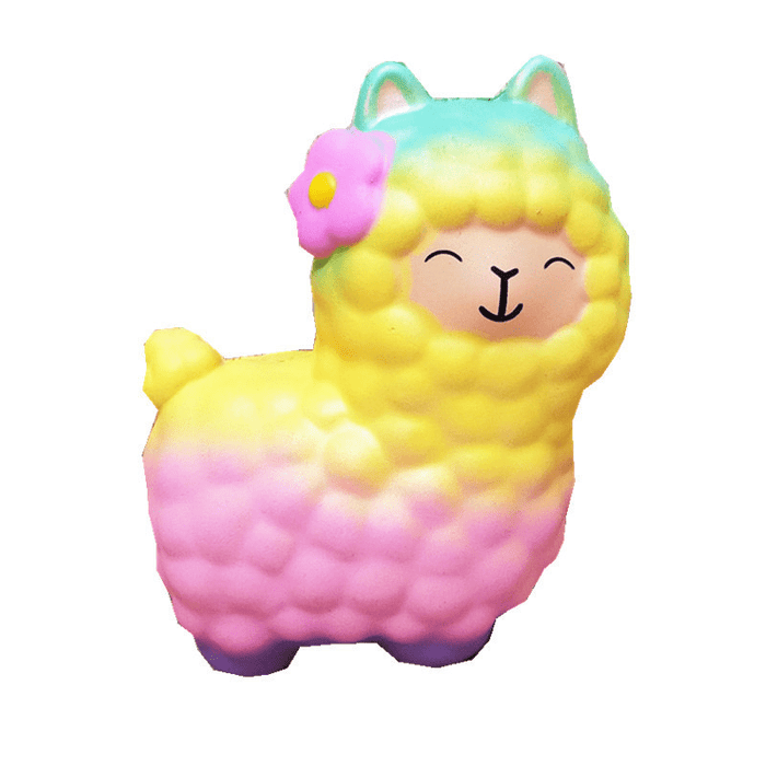 A gradient turquoise, yellow, pink and purple alpaca squishy with a pink flower on its right ear