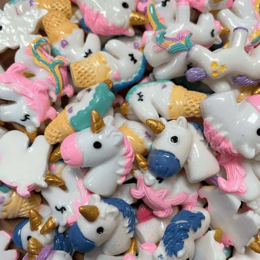 A mix of white unicorn charms