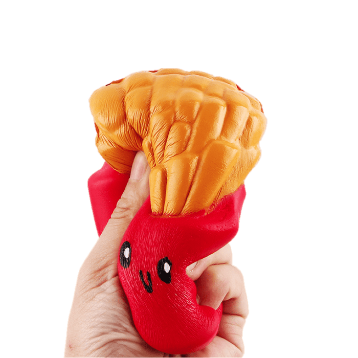 A hand squishing a squishy that looks like a red bag of fries